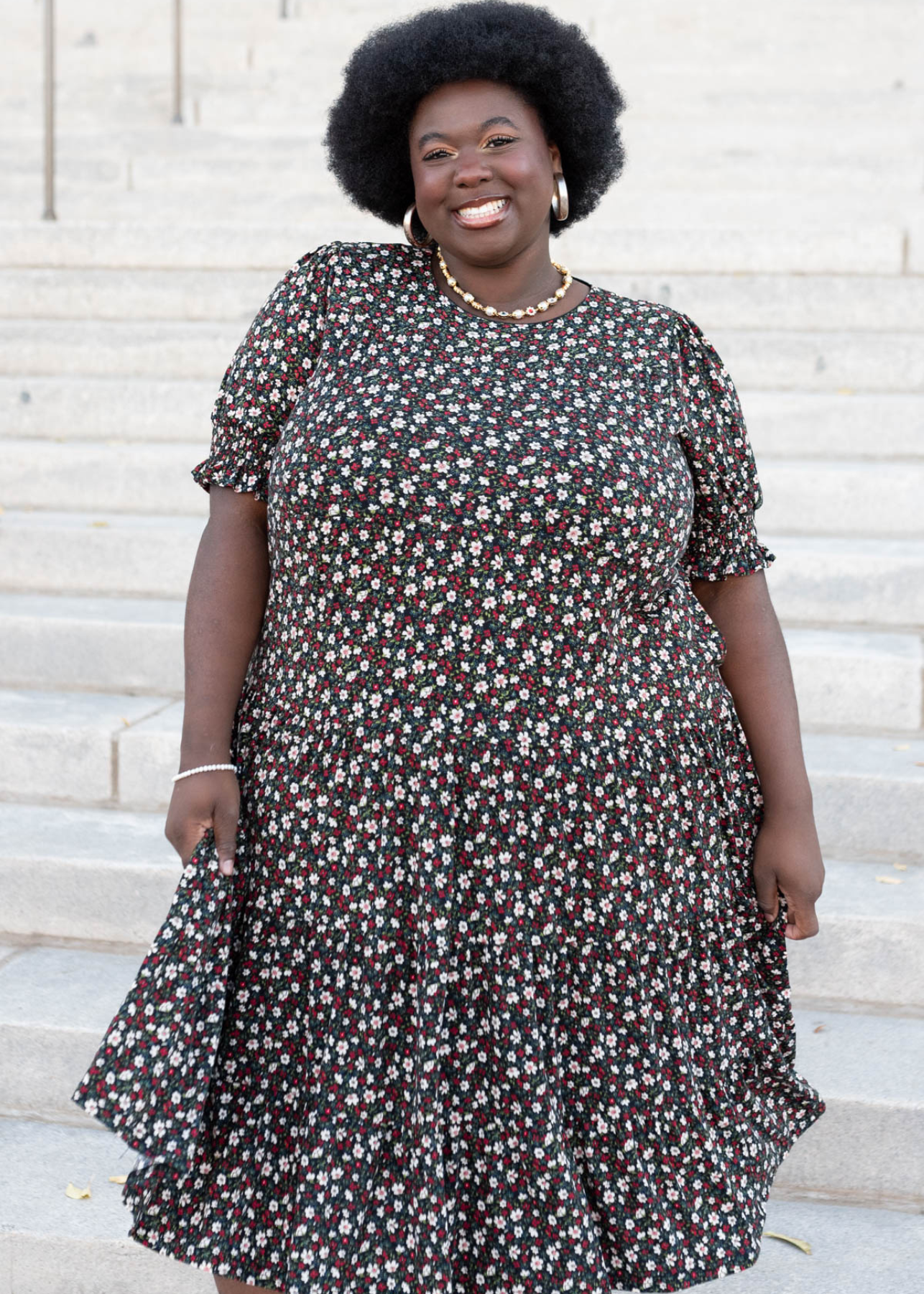 Plus size tiered floral dress with white and ed flowers