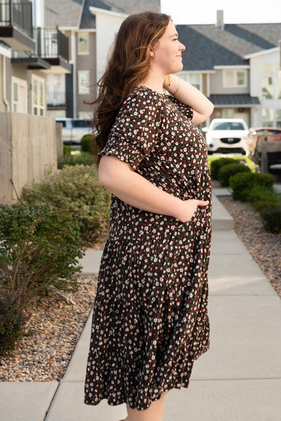 Side view of the plus size tiered floral dress