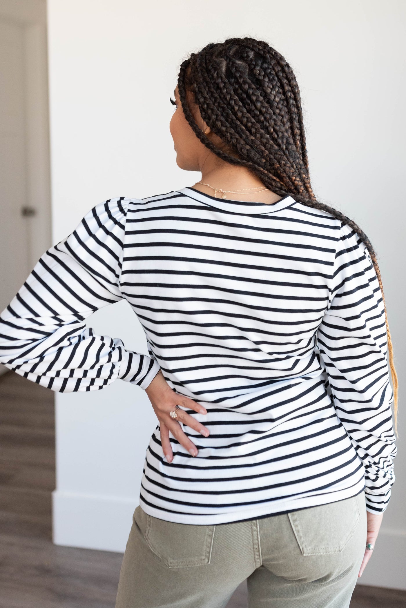 Back view of the black stripe long sleeve top