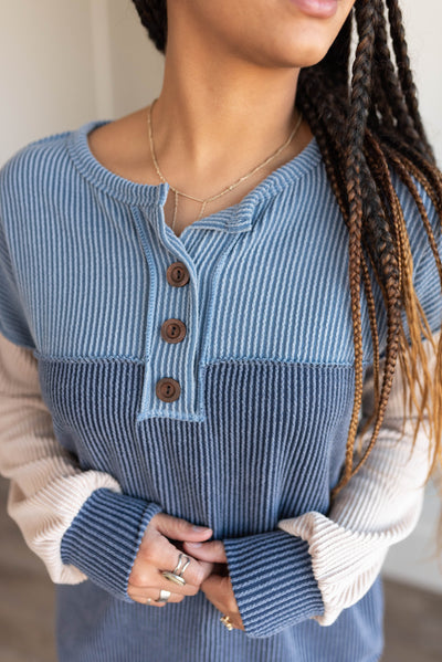 Close up of the dark denim color block top