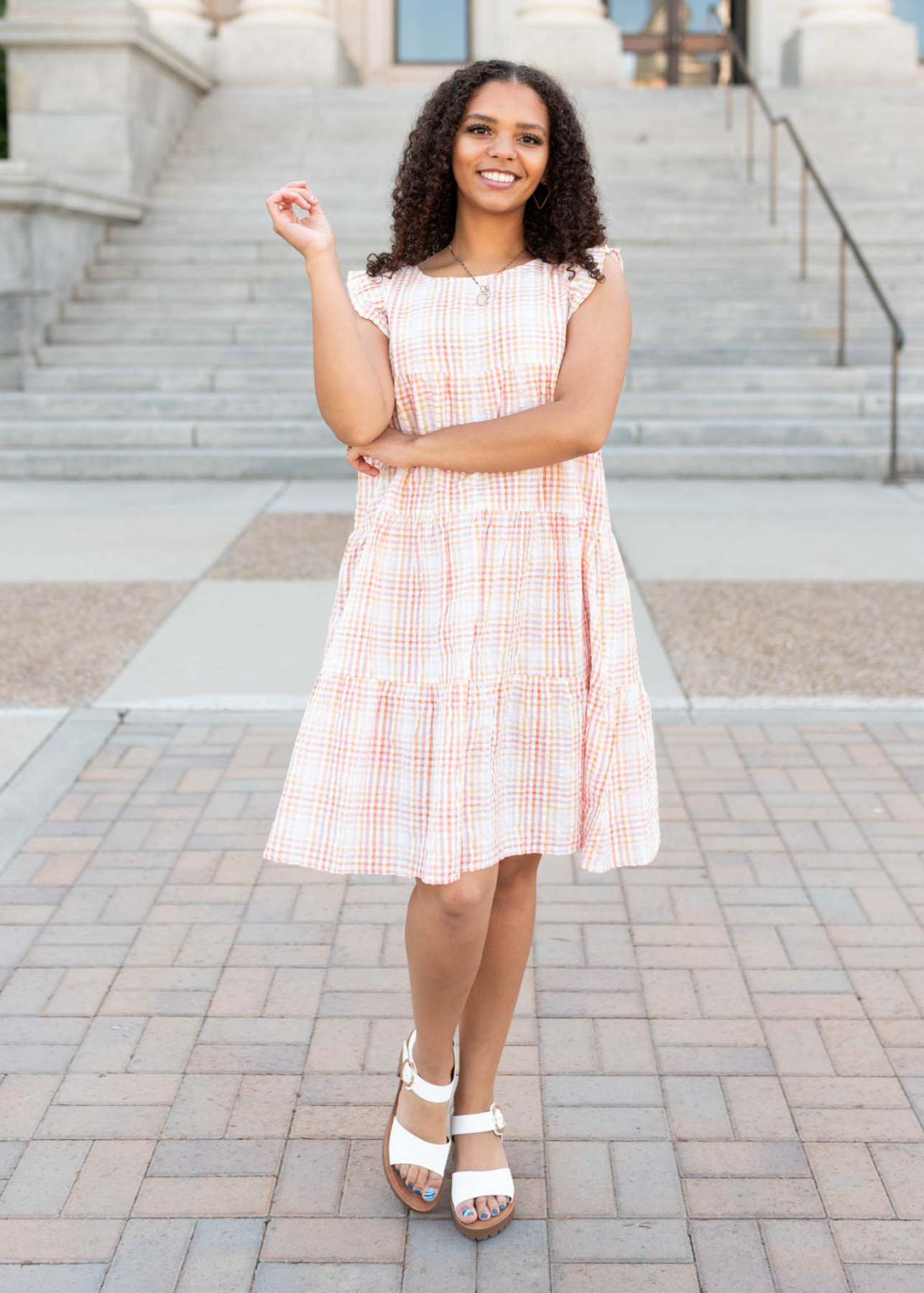 Orange plaid mini dress with tiered skirt