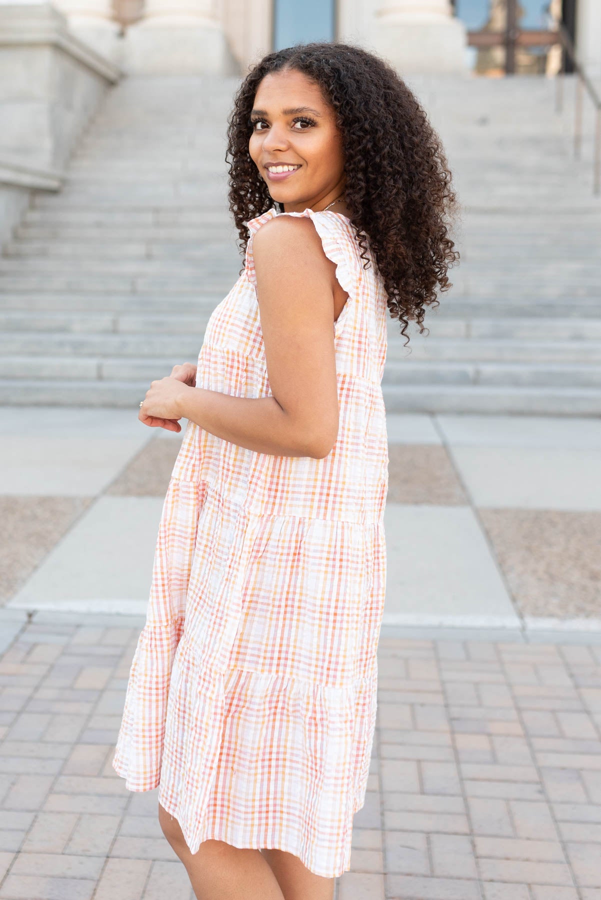 Side view of the orange plaid mini dress