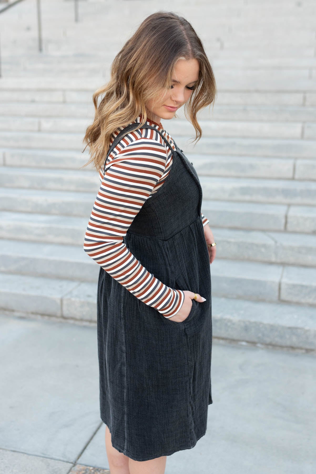 Side view of the black wash jumper dress