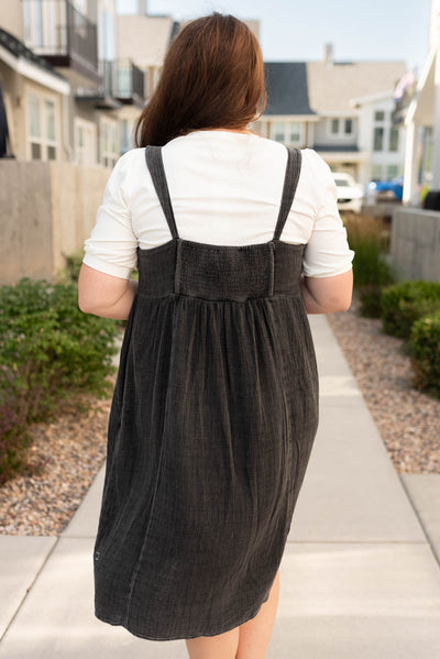 Back view of the plus size black wash jumper dress