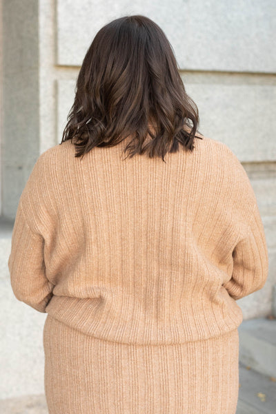 Back view of the plus size camel ribbed sweater