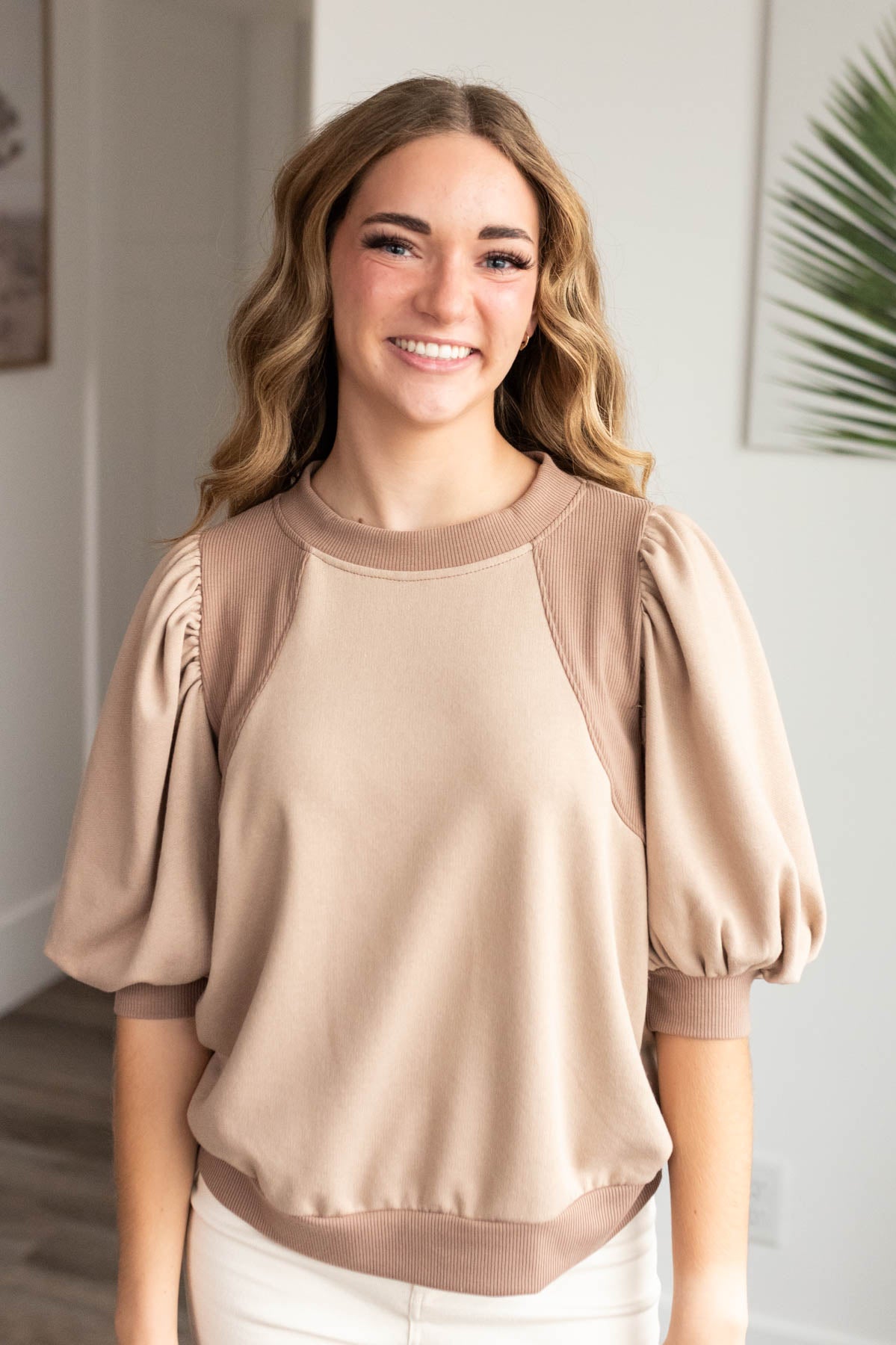 Front view of the taupe puff sleeve pullover