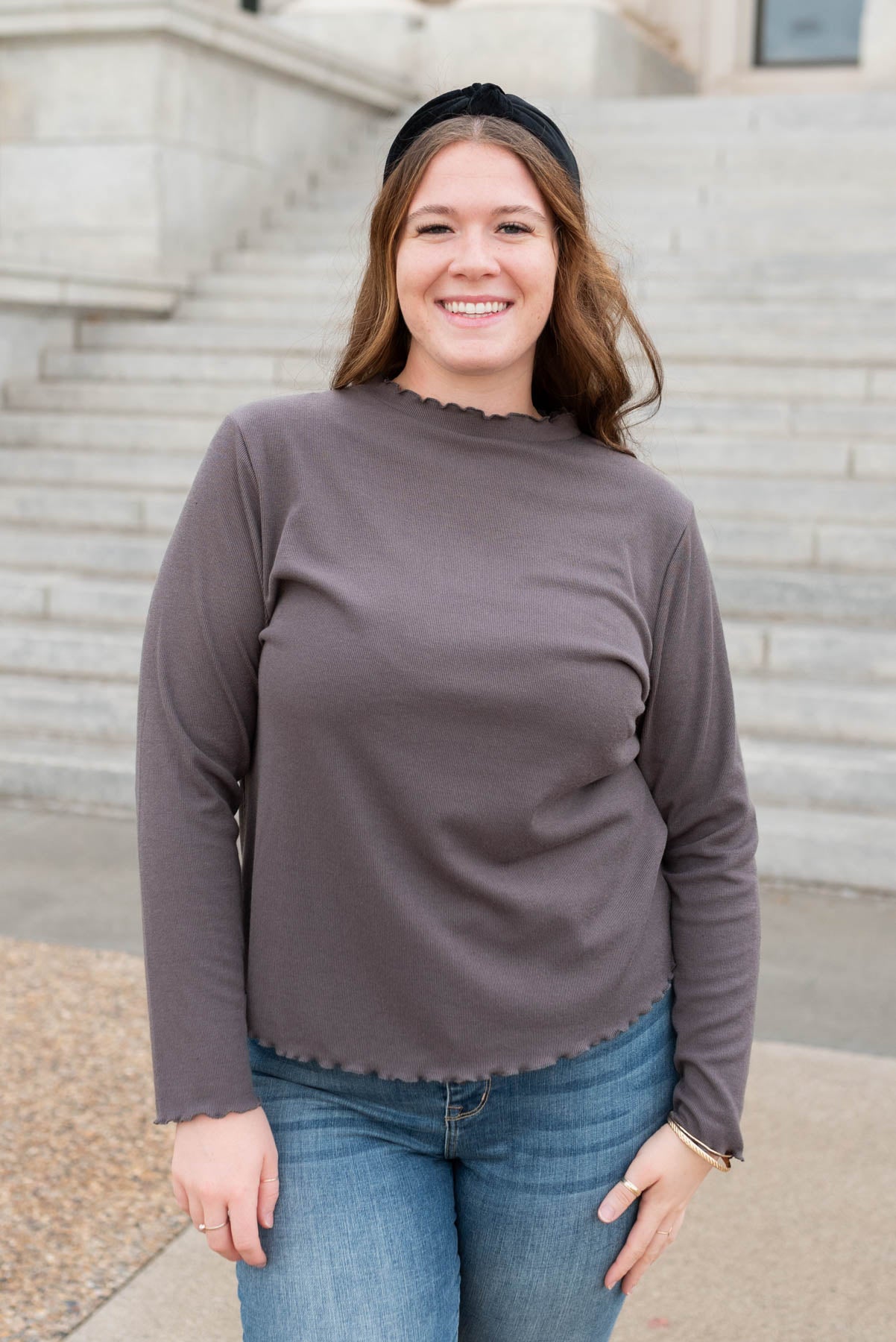 Front view of the plus size charcoal ruffle ribbed top