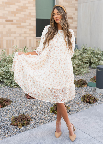 Cream floral dot dress with a tiered skirt