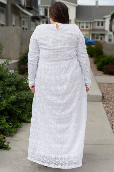 Back view of a plus size white floral dress