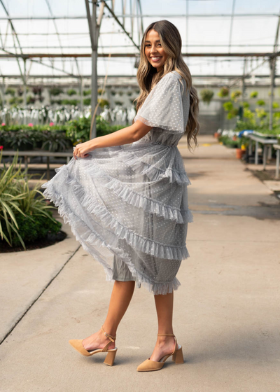 Side view of the grey blue ruffle dress