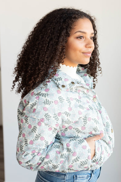 Side view of the sage floral puffer jacket