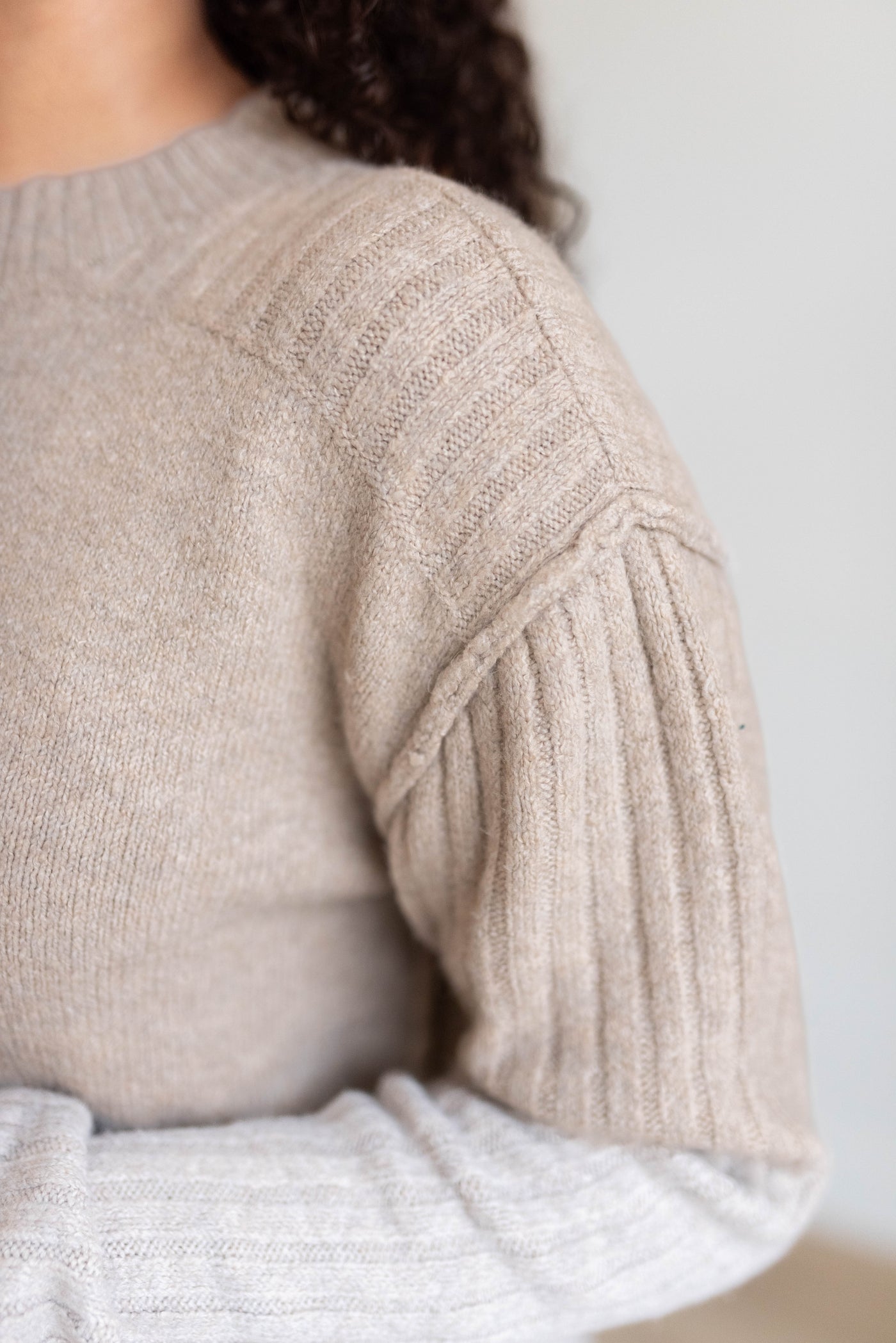 Close up of the knit pattern on the heather khaki knit sweater