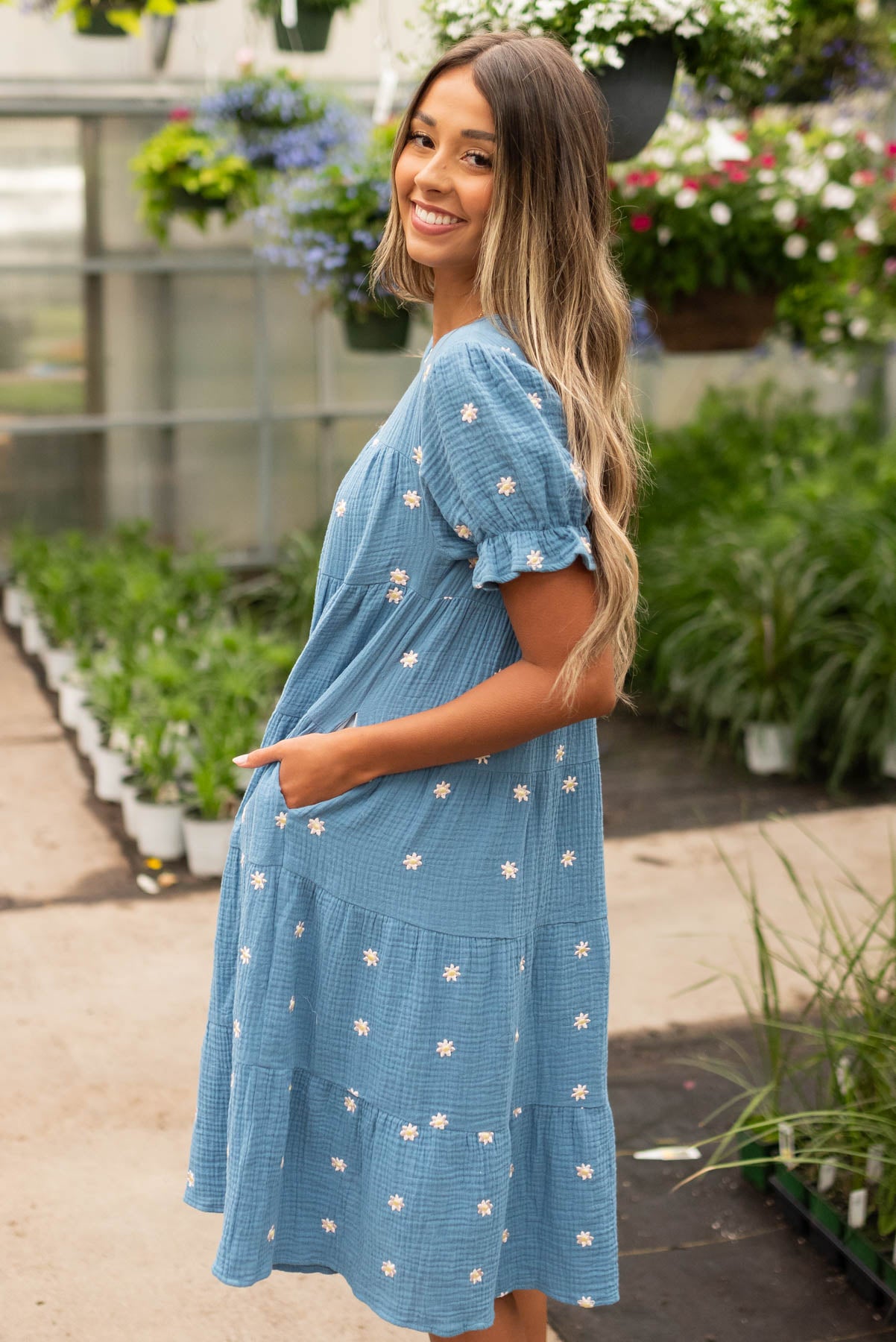 Side view of the blue floral dot dress with pockets