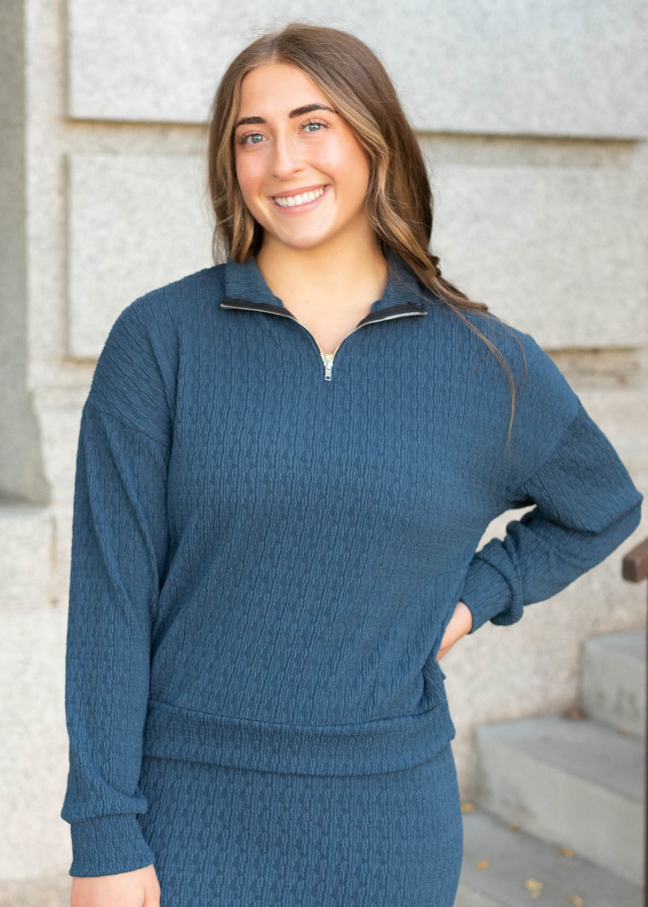 Navy knit pullover with long sleeves