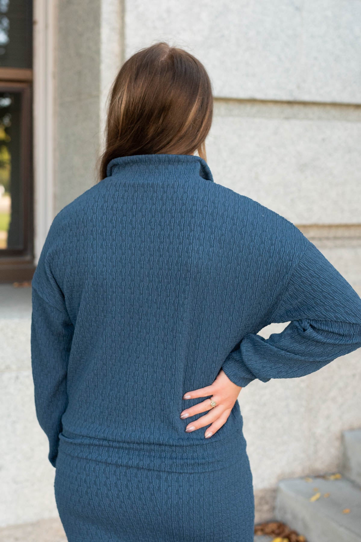 Back view of the navy knit pullover