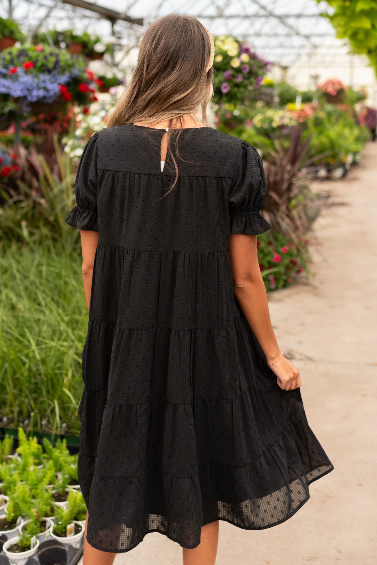 Back view of the black dot midi dress