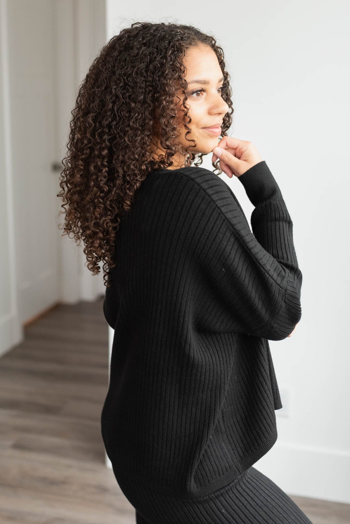 Side view of the black sweater