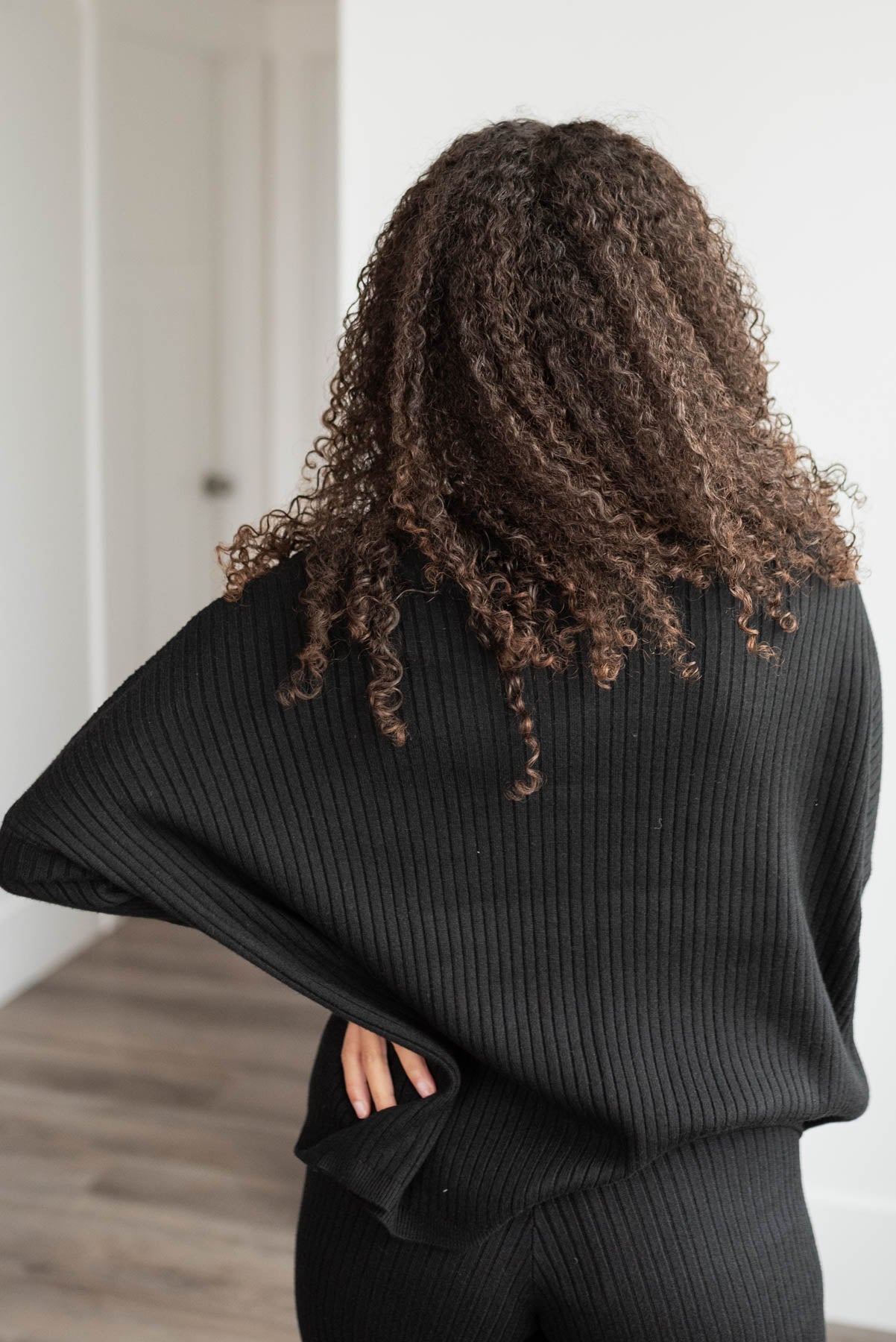 Back view of the black sweater