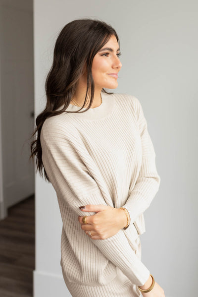 Side view of the oatmeal sweater