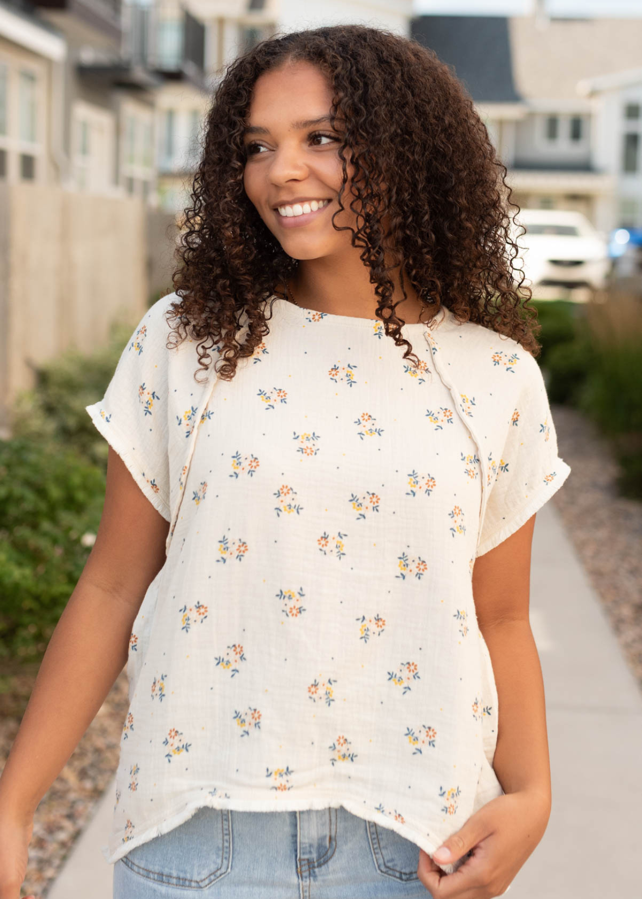 Beige floral top with outside seams