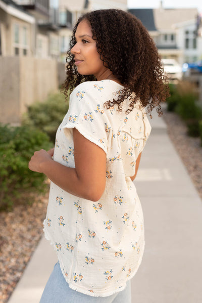 Side view of the beige floral top