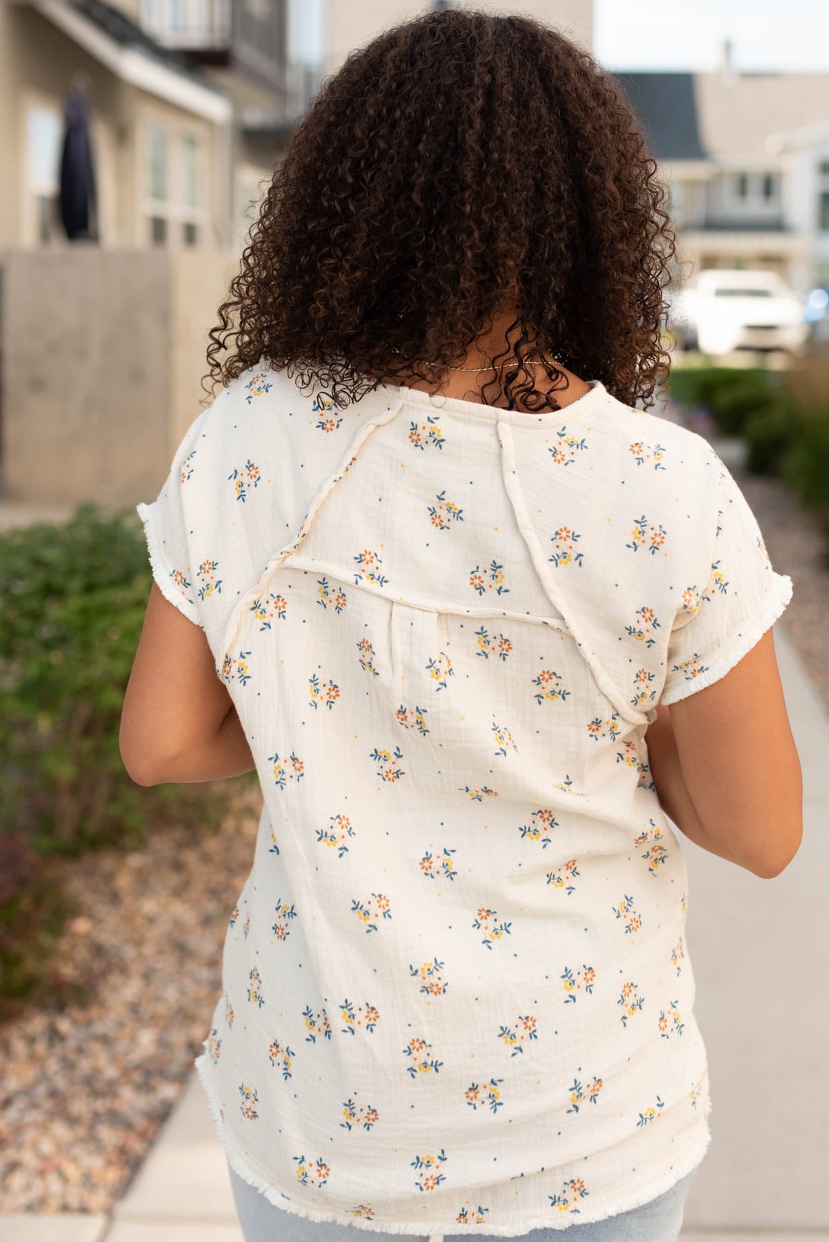 Back view of the beige floral top