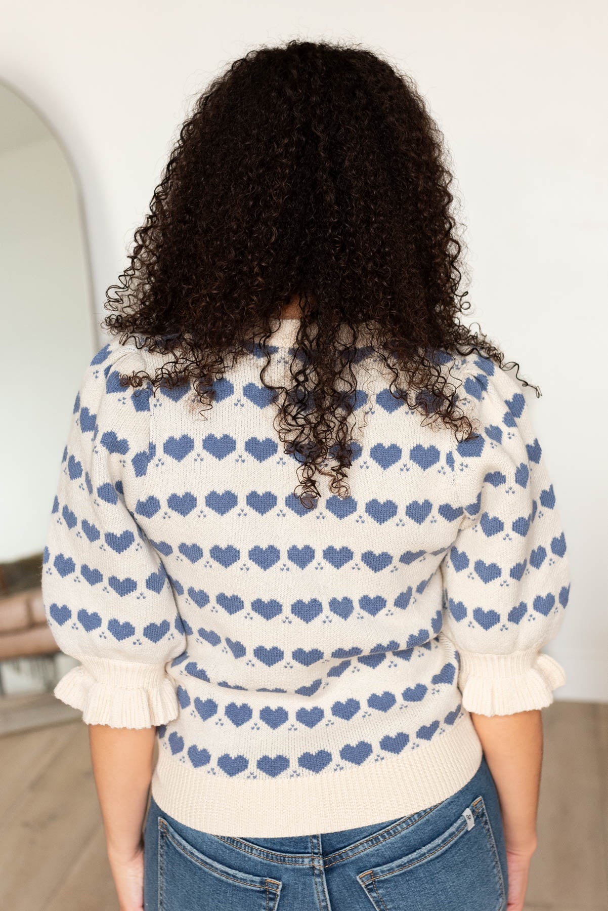 Back view of the heart stripe sweater