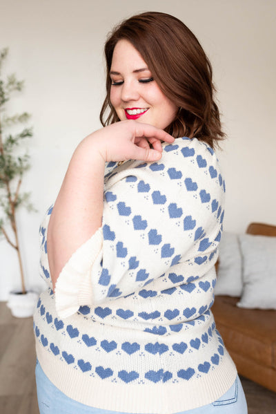 Side view of the plus size heart stripe sweater