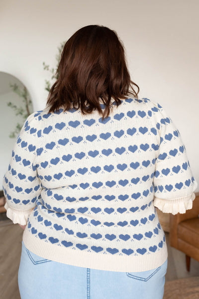 Back view of the plus size heart stripe sweater