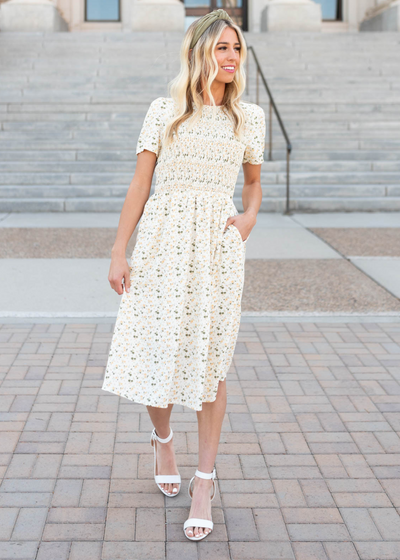 Cream floral midi dress with short sleeves and smocked bodice