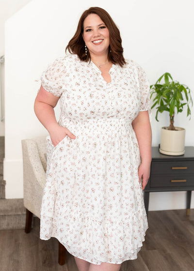 Buttons on the bodice of the plus size ivory swiss dot floral dress