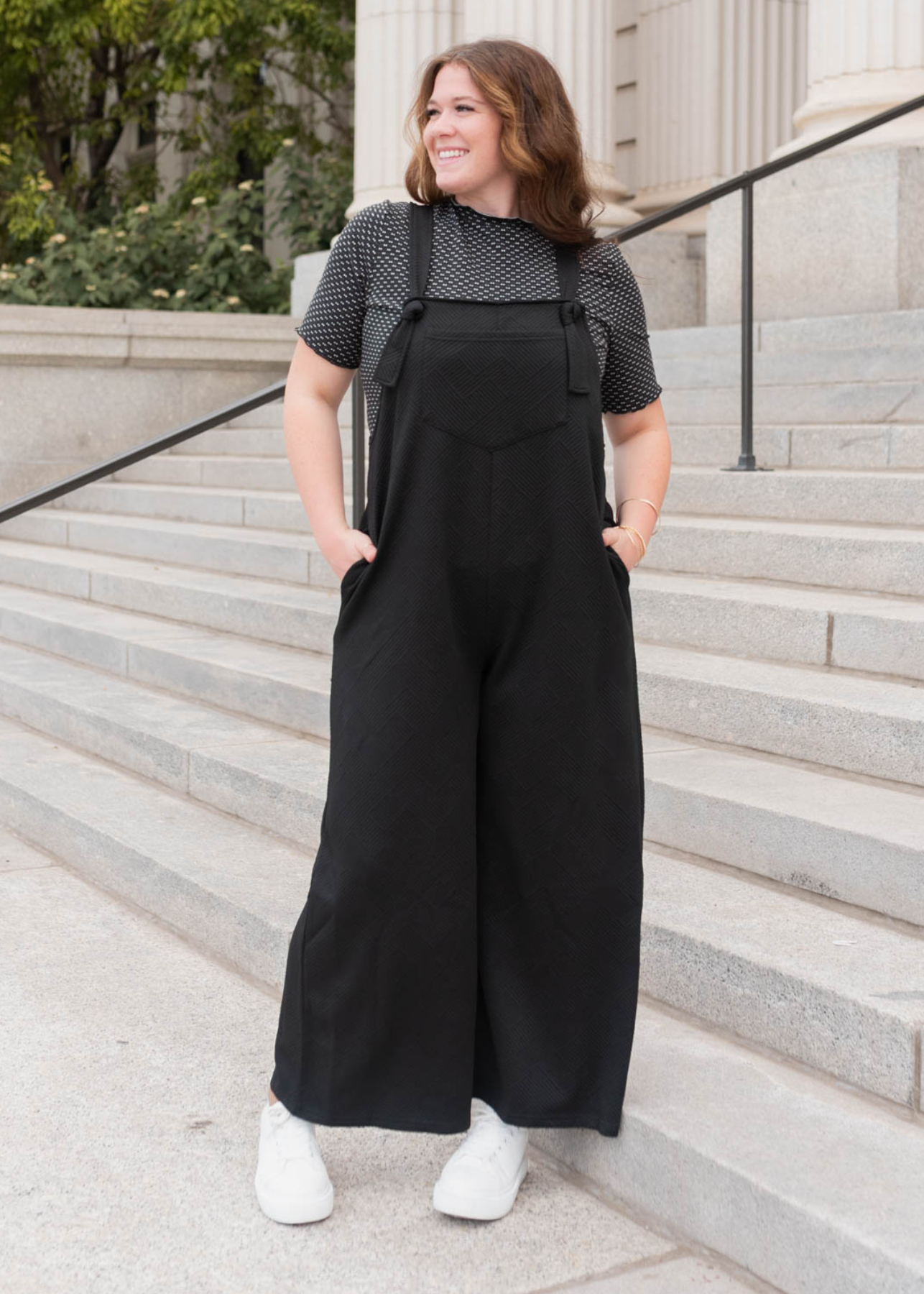 Plus size black textured overalls with pockets