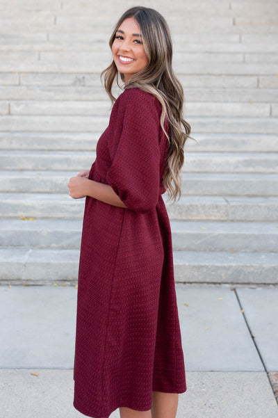 Side view of the burgundy textured dress