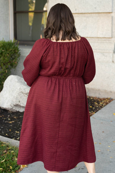 Back view of the plus size burgundy textured dress