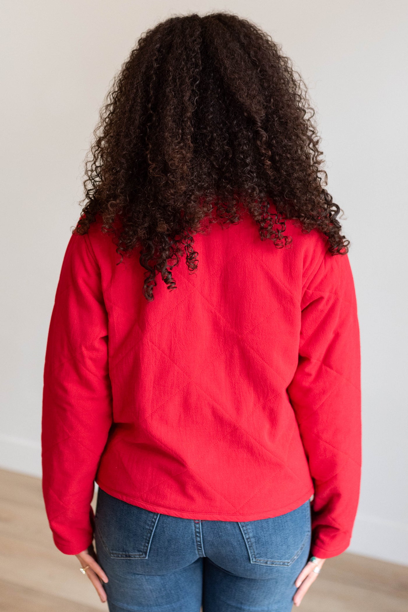 Back view of the red quilted tie jacket