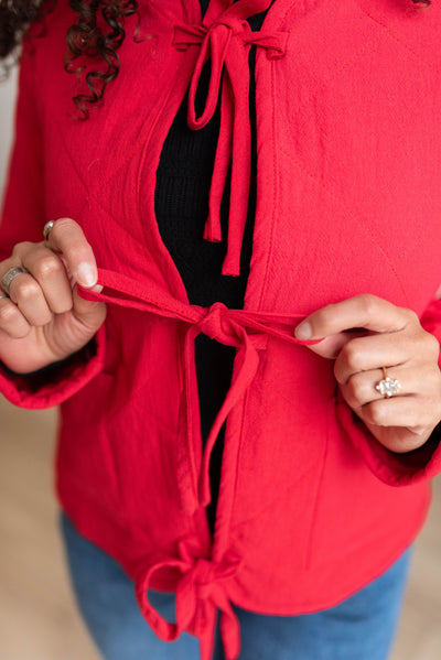 Close up of the ties on the red quilted tie jacket