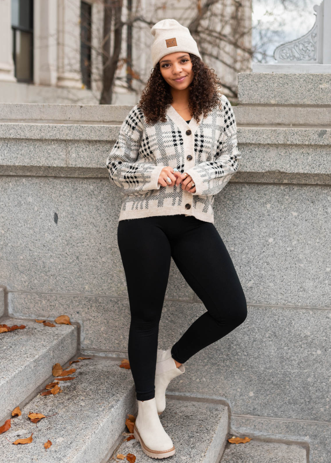 Taupe button down cardigan with a black pattern