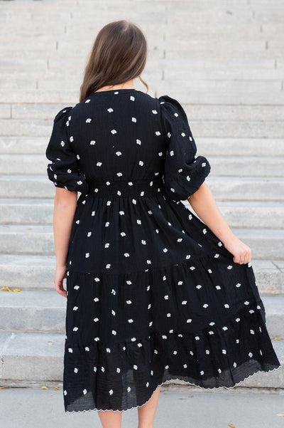 Back view of the black embroidered button dress