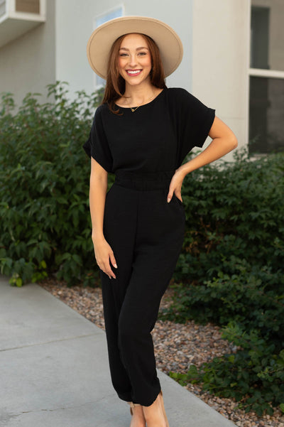 Black jumpsuit with pocket and short sleeves