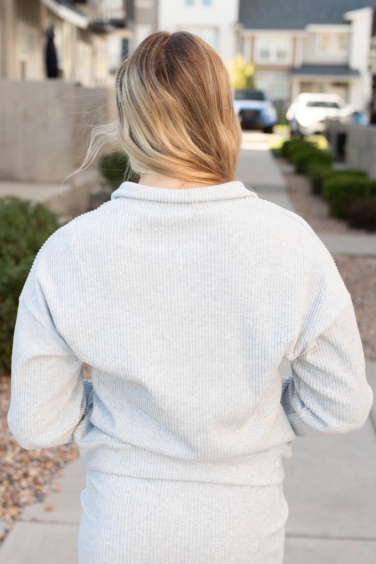 Back view of the grey ribbed knit sweater