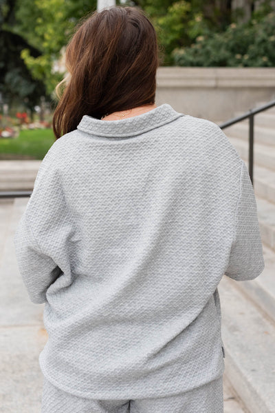 Back view of the heather grey collared knit top in plus size