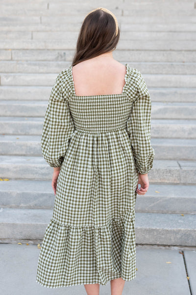 Back view of the olive gingham square neck dress