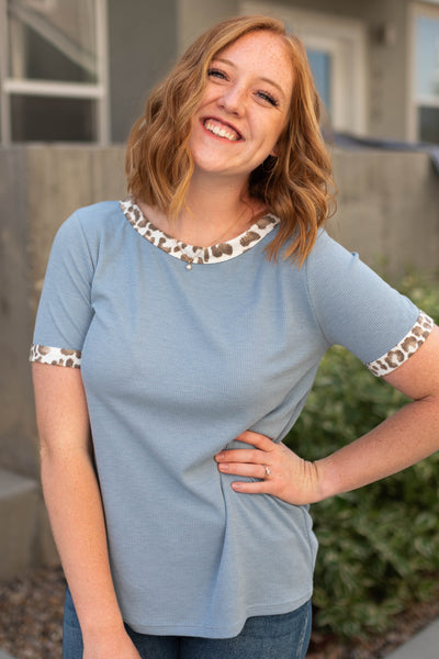 Denim blue top with animal print trim