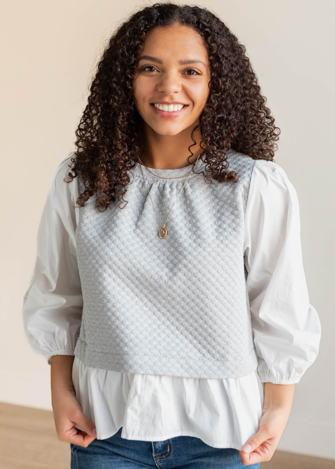 Heather greay blouse with ruffle hem