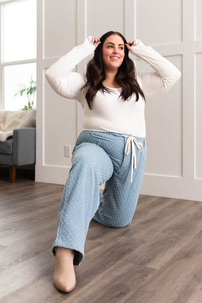 Plus size light denim pattern pants that ties at the waist