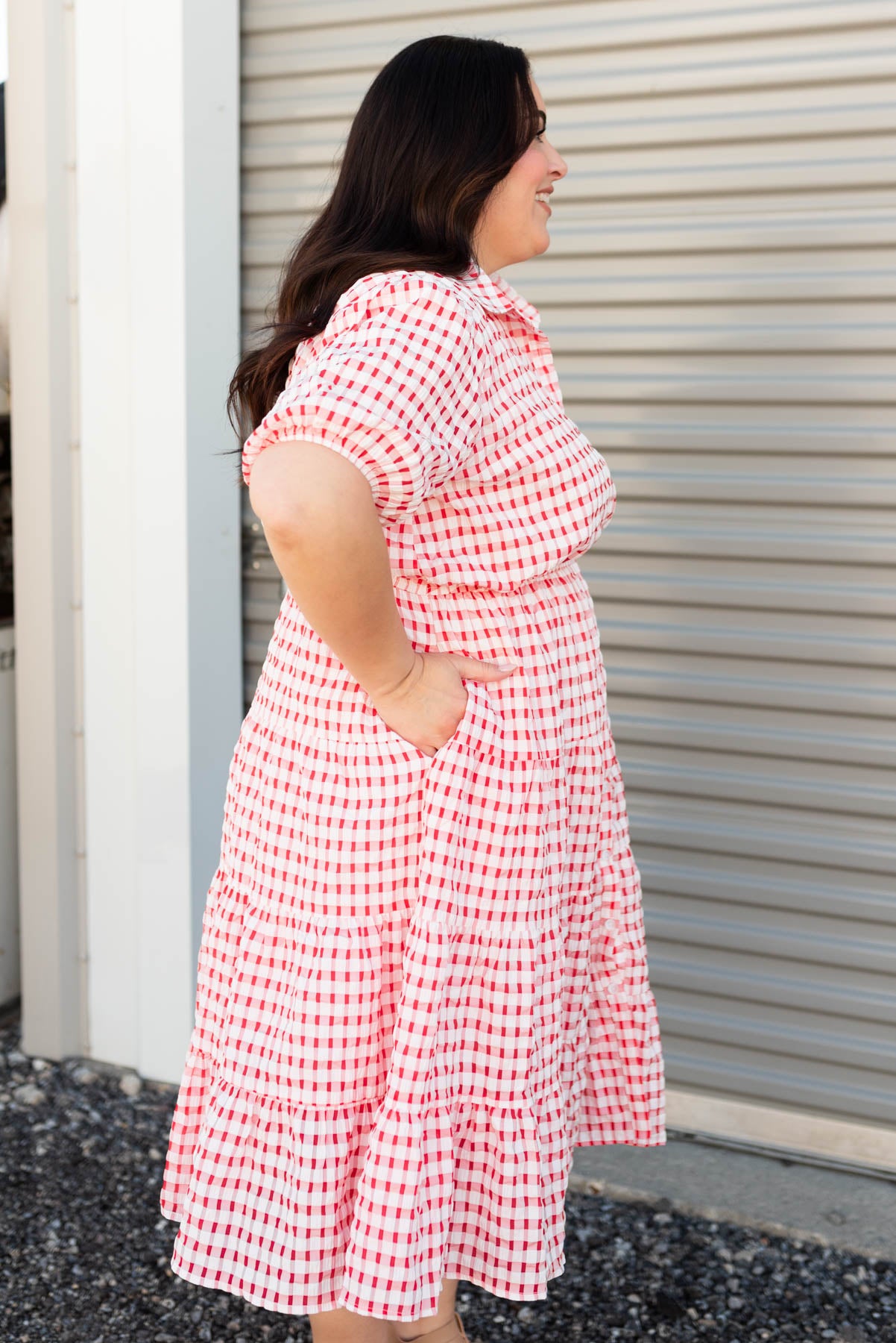 Side view of the plus size cherry plaid dress