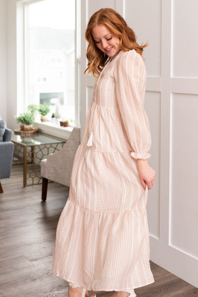 Side view of the tan patterned dress