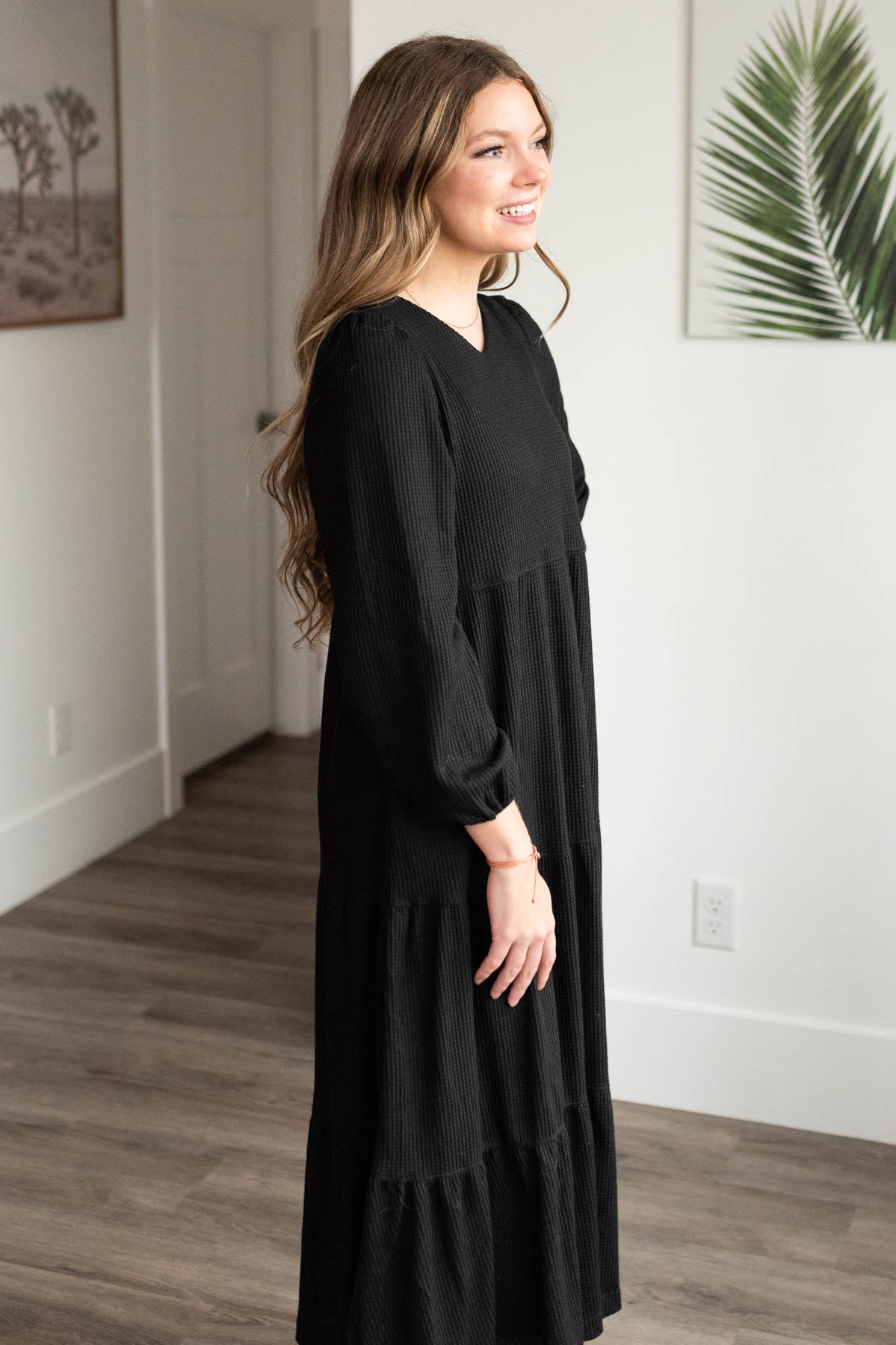 Side view of the black waffle knit dress