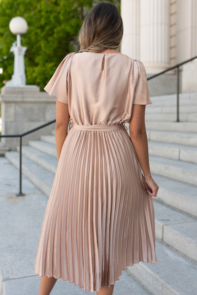 Back view of the champagne satin pleat dress