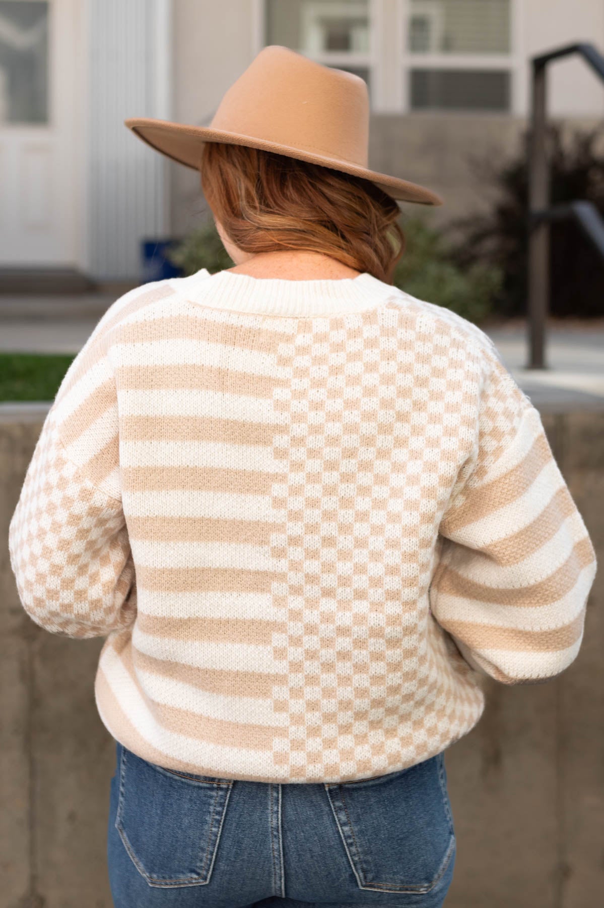 Back view of a taupe cardigan